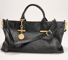 Make this soft leather beauty your everyday handbag. Goldtone accents elevate this casual style. The lined interior features multiple pockets for organization, and the dangle accessory provides a glam finishing touch. From Vince Camuto. Fall 2024 Handbag Trends, Soft Leather Purse, Trendy Purses, Everyday Handbag, Bag Women Fashion, Quilted Handbags, Quilted Purses, Patterned Backpack, Quilted Crossbody Bag