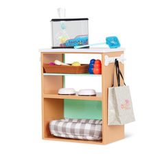 a toy shelf with items on top of it and a shopping bag in the middle