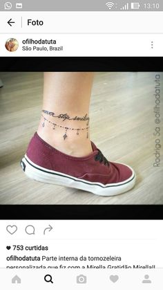 a woman's foot with a small tattoo on the side of her ankle,