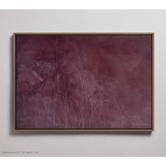 an abstract painting hanging on the wall