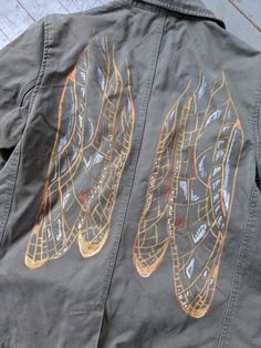 Delicate wings of silver, gold and copper stretch over the back of an olive green denim jacket. Double breasted button front. Machine washable. Gently worn upcycled condition. Women's size medium. Customizing Clothes, Olive Green Denim Jacket, Green Denim Jacket, Dragonfly Wings, Diy Fashion, Diy Clothes, Custom Clothes, Aesthetic Clothes