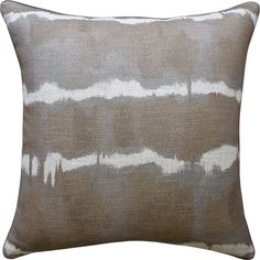 a brown and white pillow on a white background