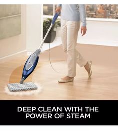 a woman is using a steam mop to clean the floor