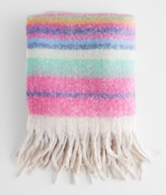 a multicolored blanket hanging on a wall