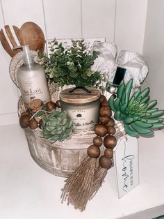 an assortment of items are displayed on a counter top, including soaps and wood spoons