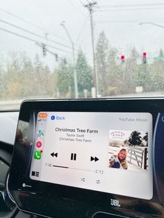 the dashboard of a car with music playing on it