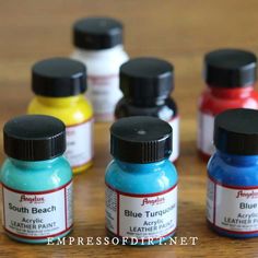 several different colors of acrylic paint sitting on a table with text overlay