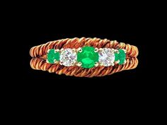 bought from a private collection i am not a jeweler but here is the description i was given by people that know much more than me   i dont see any markings but its what i was told jewelry box 17 18K yellow gold rope style ring, prong set with round cut emeralds, apprx .42 cts., and. two round cut diamonds, apprx .22 cts. tdw. Gold Band Ring, Gold Band, Round Cut Diamond, Gold Bands, Band Ring, Prong Setting, Drake, Round Cut, Band Rings