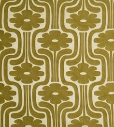 a green and white rug with an abstract design on the front, featuring large flowers