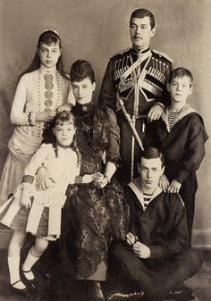 an old black and white photo of a family