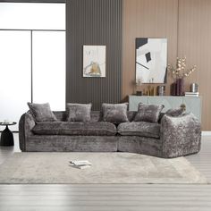 a living room filled with furniture and a rug