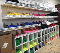 the shelves are filled with many different colored items