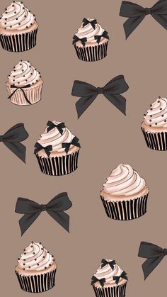 cupcakes with black bows and white frosting on a brown background, seamless