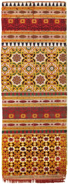 an orange, yellow and red rug with geometric designs on it's sides is shown