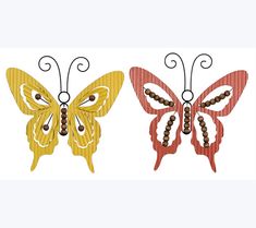 two metal butterfly wall hangings with beaded beads on each side and one has an intricately detailed design