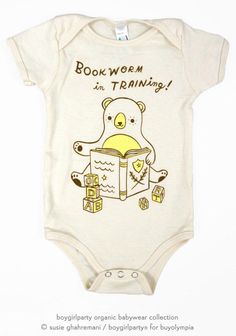 a baby bodysuit with an image of a bear reading a book that says, bookworm i'm training