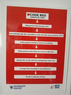 a red and white sign with instructions on how to use the code for safety purposes