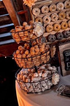 a table topped with baskets filled with donuts