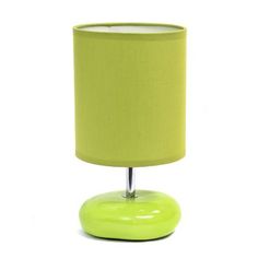 a yellow lamp with a green shade on it's base and a white background