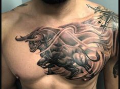 a man with a bull tattoo on his chest