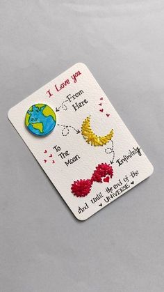 a card with the words, i love you to the moon and back on it