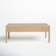 a wooden coffee table with two drawers on one side and an open drawer on the other