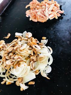 chopped onions and mushrooms on a black surface