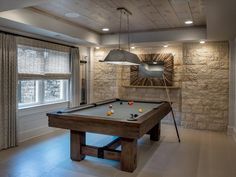 a pool table in the middle of a room