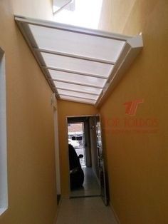 an empty hallway with a white awning over the door