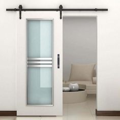 an open sliding door in a white room