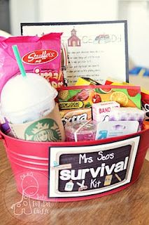 a red bucket filled with snacks and drinks