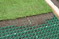 the grass is being laid on top of the ground in preparation to be dug into the soil