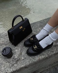 If you're looking for a pair of chic women's shoes, why not invest in a pair of designer loafers that will elevate SO many of your looks? We love these trendy black Chanel loafers for example, styled here with a black Hermes Kelly bag and preppy white socks. Ski Outfits, Chanel Loafers, Pernille Teisbaek, Loafers Outfit, Hermes Constance, Shopping Chanel