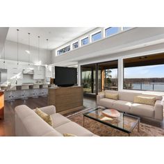 a living room filled with furniture and a flat screen tv