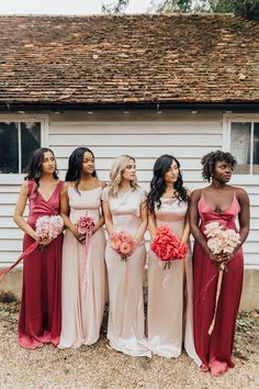 the bridesmaids are all wearing different colored dresses