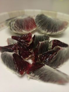 several pieces of fruit sitting on top of a white plate