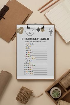 a clipboard with the words pharmacy emoj on it next to some craft supplies