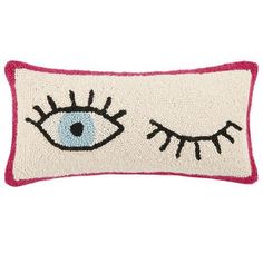 a pillow with an eye on it