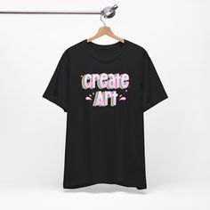 Express your passion for art with our "Create Art" graphic t-shirt. Designed to inspire artists and art teachers, this tee showcases a vibrant and eye-catching design that beautifully captures the essence of creativity. Made from premium quality materials, it offers both comfort and durability, perfect for everyday wear or as a statement piece in the art studio or classroom. Whether you're an artist seeking motivation or an art teacher looking to inspire your students, this tee is a must-have addition to your wardrobe. Makes a thoughtful gift for art lovers, creative souls, and the dedicated art educators in your life. Embrace your artistic spirit and let this tee be a symbol of your love for art and self-expression. .: 100% Airlume combed and ringspun cotton (fiber content may vary for di Graphic Tee T-shirt For Artistic Expression With Custom Artwork, Artistic Cotton T-shirt With Graffiti Print, Graphic Design Cotton Art Tee, Relaxed Fit T-shirt With Custom Artwork For Artistic Expression, Artistic Graphic T-shirt, Artistic Graffiti Print T-shirt Relaxed Fit, Artistic Graffiti Print T-shirt In Relaxed Fit, Artistic Relaxed Fit T-shirt With Graffiti Print, Artistic Cotton Art With Letter Print