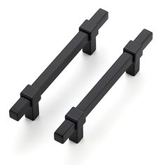 two black cabinet handles on a white background