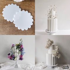 four different white vases with flowers on them and one has a flower arrangement in the middle