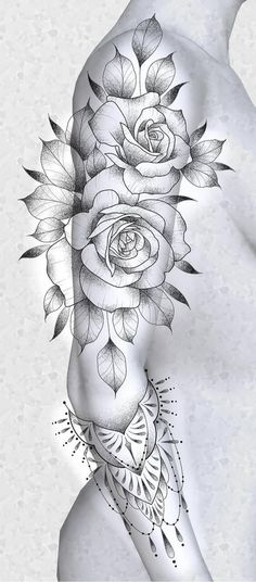 a woman's arm with flowers and leaves on it