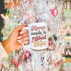 a person holding a coffee mug with the words mommy needs a student night on it