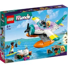 a lego box with an airplane in the water and people on it's side