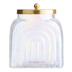 a glass jar with a gold lid