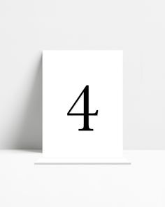 a white card with the number four printed on it