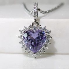 Nwot Vintage Heart Center Stone With Lab Grown Color Change Purple Blue Alexandrite And 14k White Gold. The Setting Is Vermeil 14k White Gold Over 925 Sterling Silver To Last A Lifetime. * Approx 4 Cttw * 3 Cttw Lab Brown Color Change Alexandrite * 1 Cttw Simulated White Diamonds * 14k White Gold Vermeil Plated * 925 Sterling Silver Hallmark Stamped Measurements Are Approximate Purple Gem Necklace, Purple Heart Cut Jewelry For Formal Occasions, Purple Heart Cut Jewelry For Formal Events, Luxury Purple Necklace For Anniversary, Luxury Purple Necklaces For Anniversary, Formal Purple Necklace For Valentine's Day, Purple Cubic Zirconia Jewelry For Valentine's Day, Purple Sterling Silver Heart Cut Necklace, Purple Heart Cut Sterling Silver Necklace