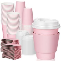 pink and white cups are stacked on top of each other, with one cup in the middle