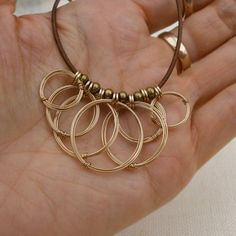 Gold Open Circles Leather Necklace Gold Rings Pendant Cluster Modern Brown Brass Jewelry, Minimalist Brown Brass Jewelry, Wire Sculpting, Leather Cord Jewelry, Boho Jewellery Necklaces, Wire Necklaces, Wire Pendants, Hammered Jewelry, Wire Jewelry Making