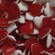 red and white heart shaped candies in a pile